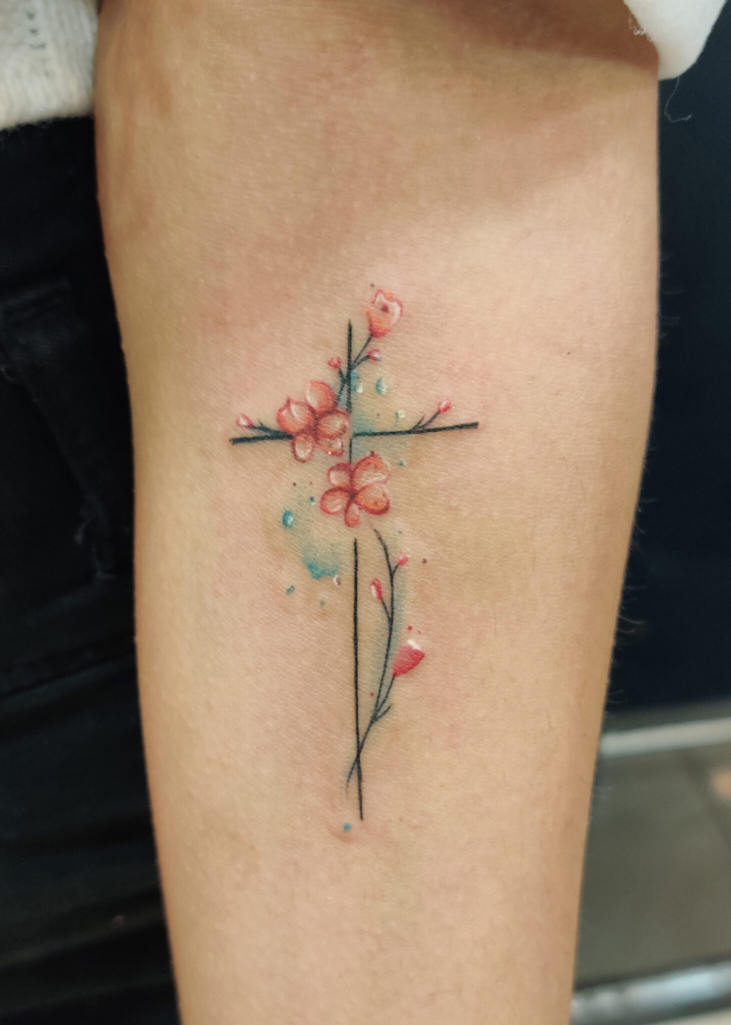 cross flower girl tattoo